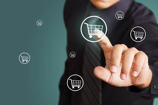 15892058 - business man pressing shopping cart icon